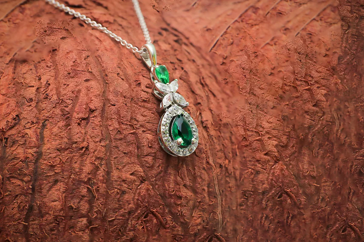 Emerald Swirl Pendant in silver, product photograph